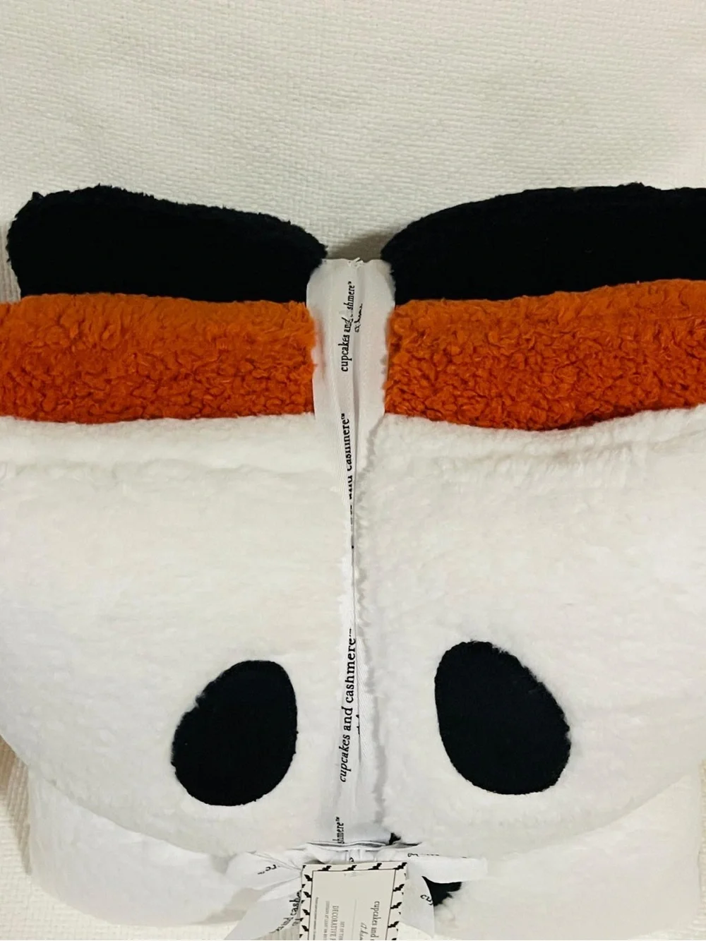 cupcakes & cashmere White Plush Throw with Black & Brown Accents
